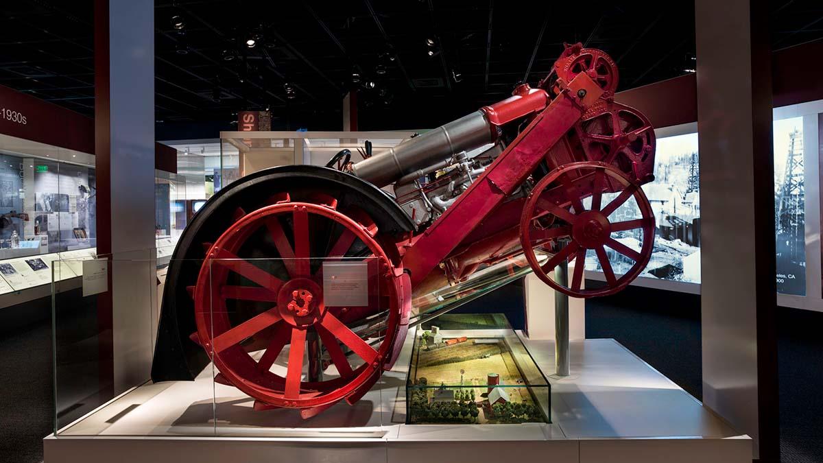 Exhibit display featuring early tractor